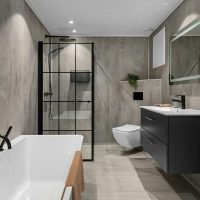 A bathroom with a large bathtub next to a toilet